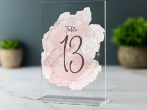 A picture of acrylic wedding table numbers with nice background